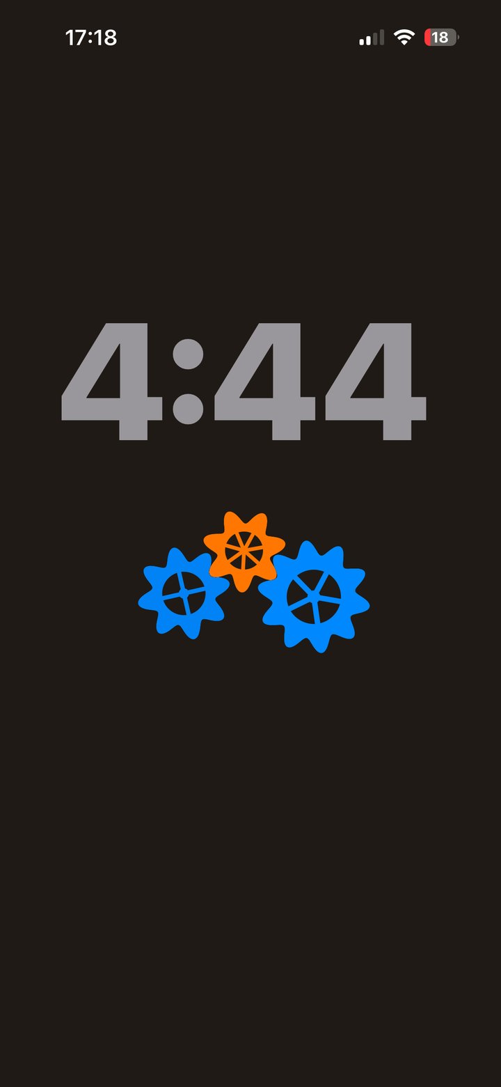 A large gray 4:44 countdown above a small train of three gears, two blue and one orange, on a near-black background.